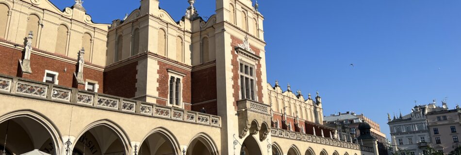 Sukiennice Cloth Hall in bright sunshine Best Things To Do in Krakow Poland