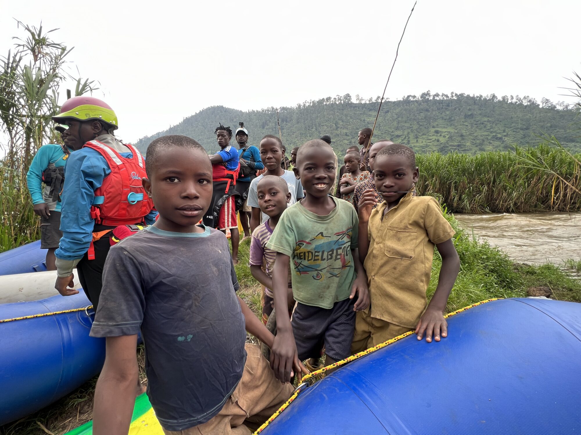 Three kids beside the rafts